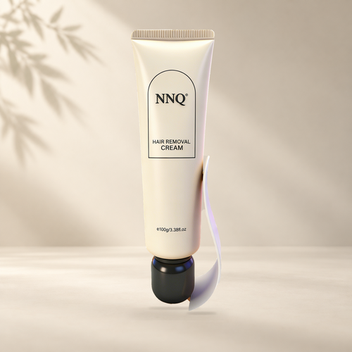 NNQ Hair Removal Cream 100 g tube with included scraper in a warm ivory setting